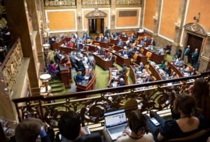 Lawmakers meet in the House chamber at the Capitol in Salt Lake City on the second day of the legislative session. Utah health officials on Wednesday told lawmakers that the omicron variant of COVID-19 will spread regardless of community mitigation efforts, but masks will slow the spread.