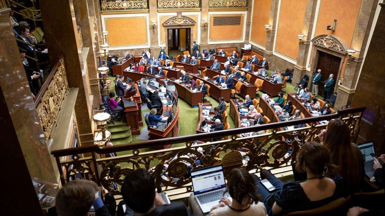 Lawmakers meet in the House chamber at the Capitol in Salt Lake City on the second day of the legislative session. Utah health officials on Wednesday told lawmakers that the omicron variant of COVID-19 will spread regardless of community mitigation efforts, but masks will slow the spread.