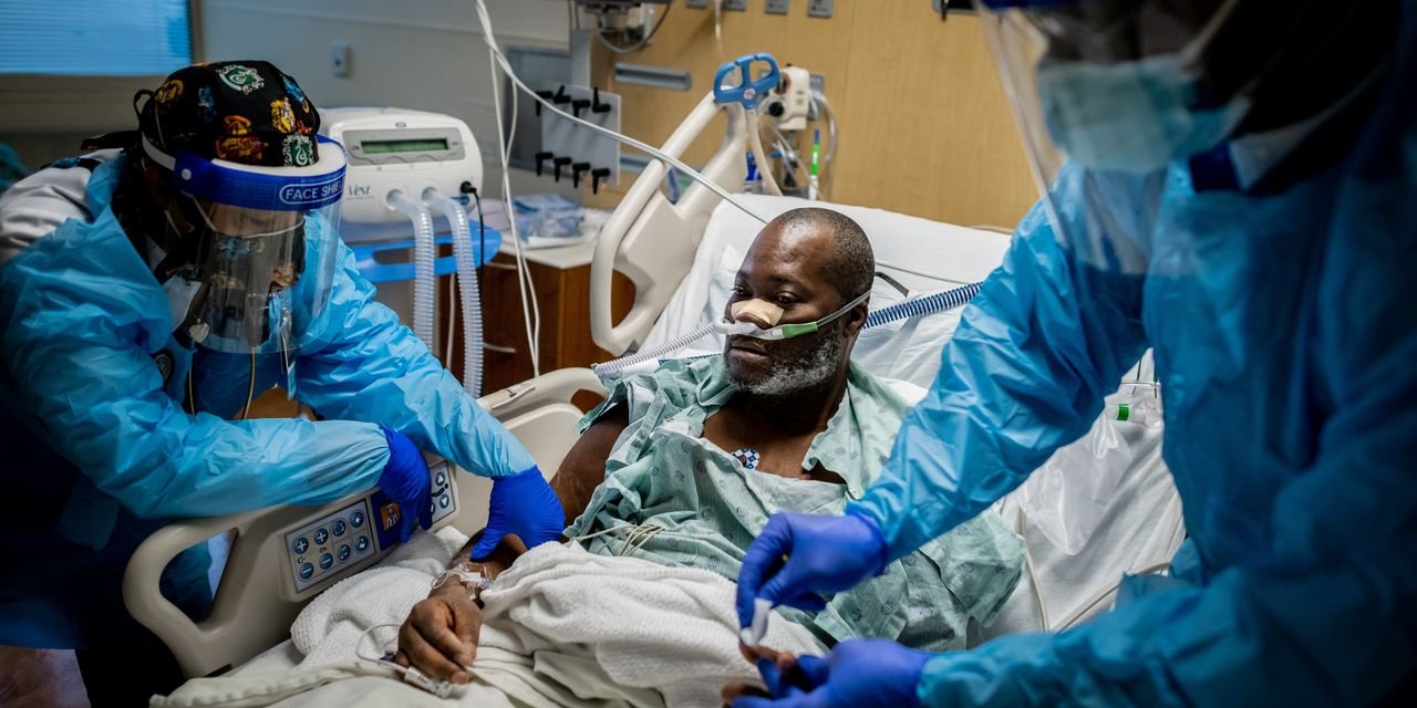 In Hospital Strained by Omicron, Weary Nurses Treat Too Many Patients