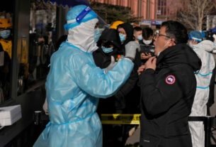 Beijing locks down office building weeks before Olympics over single Omicron case