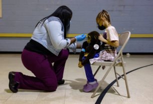 A healthcare worker pretends to administer a dose of the Pfizer-BioNTech Covid-19 vaccine to a child's stuffed animal at a Salvation Army vaccination clinic in Philadelphia, Pennsylvania, U.S., in this file photo dated November 12, 2021.